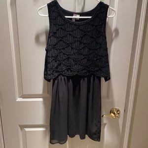 small black dress with beads on top